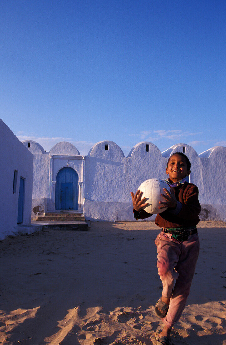 Boy with ball in Menzel, near Midoun, Djerba Tunesia