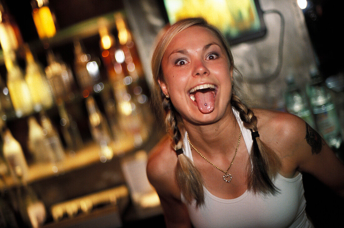 Barmaid sticking out tongue, Ground Zero Club, Warsaw, Poland