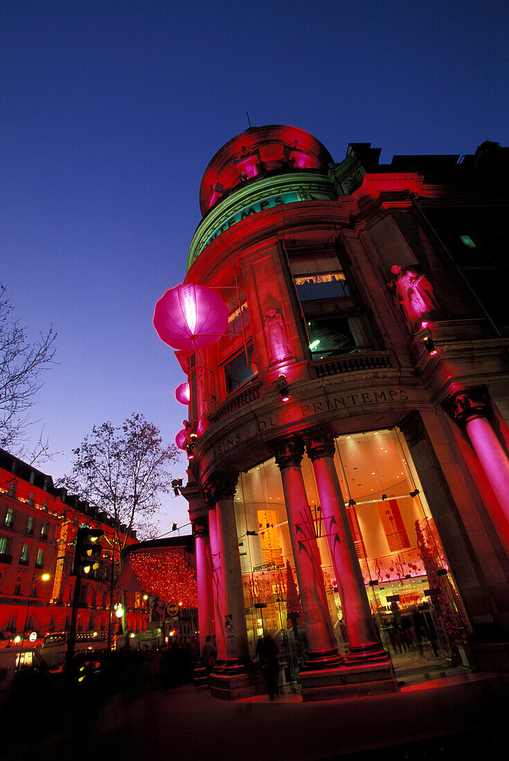 The illuminated Printemps department store in the evening, Paris, France, Europe