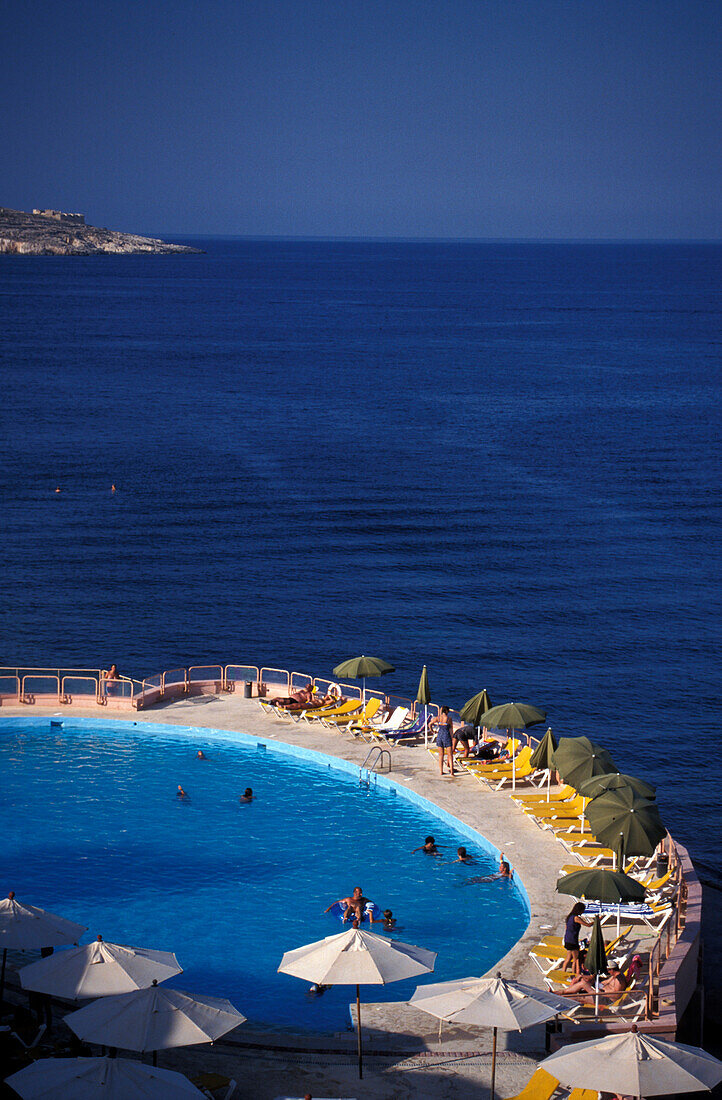 People at the pool of Comino Hotel, Comino Island, Malta, Europe