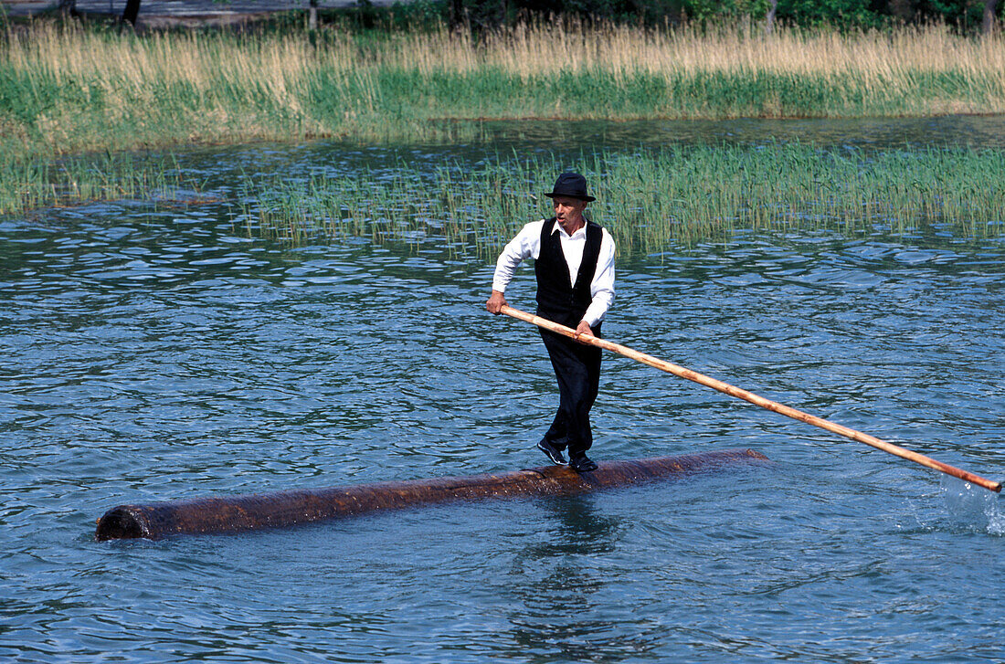 Lumberjack on a log, Midsummer Festival, Seurasaari Island, Helsinki, Finland, Europe