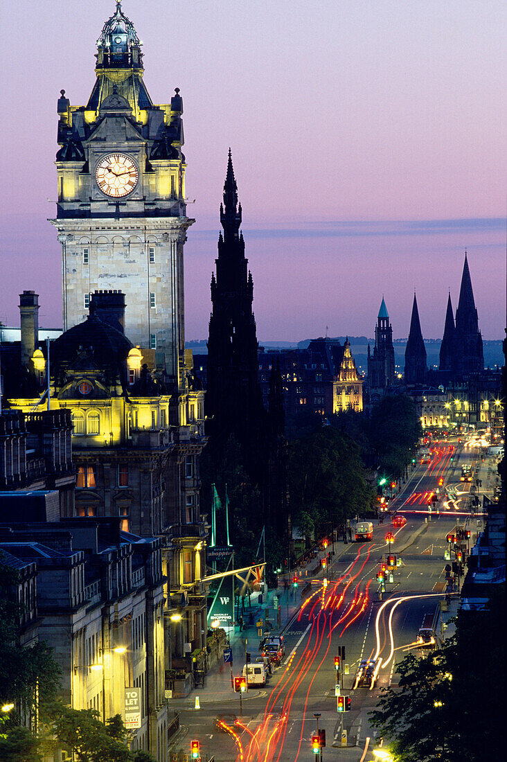 Illuminated clock tower and Princess Street at night, Edinburgh, Scotland, Great Britain, Europe