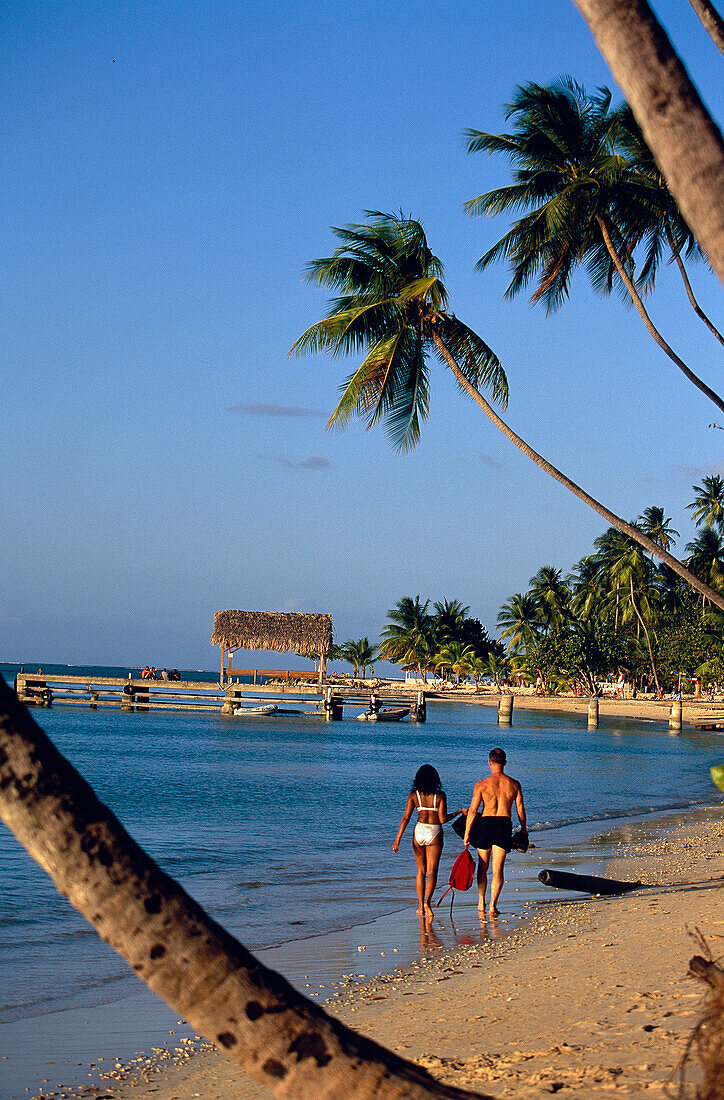 Couple on Pigeon Point Beach, Tobago Caribbean