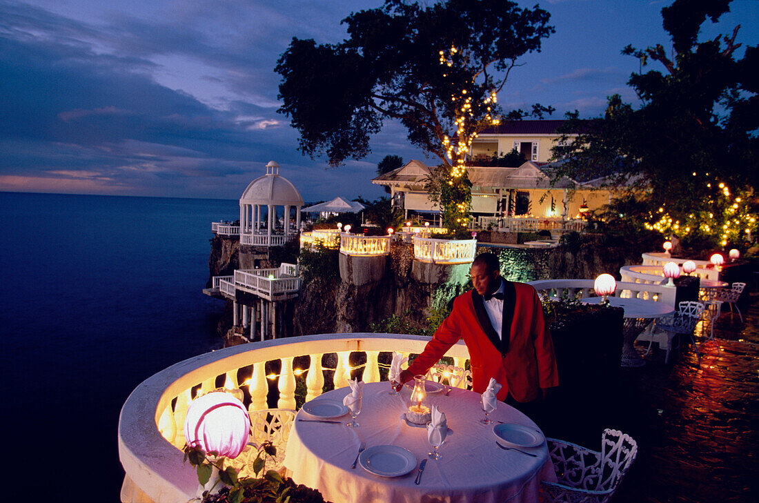 Waiter preparing the table for diner, La Puntilla De Piergiorgio Palace, Italian Restaurant, Sosua, Dominican Republic, Caribbean