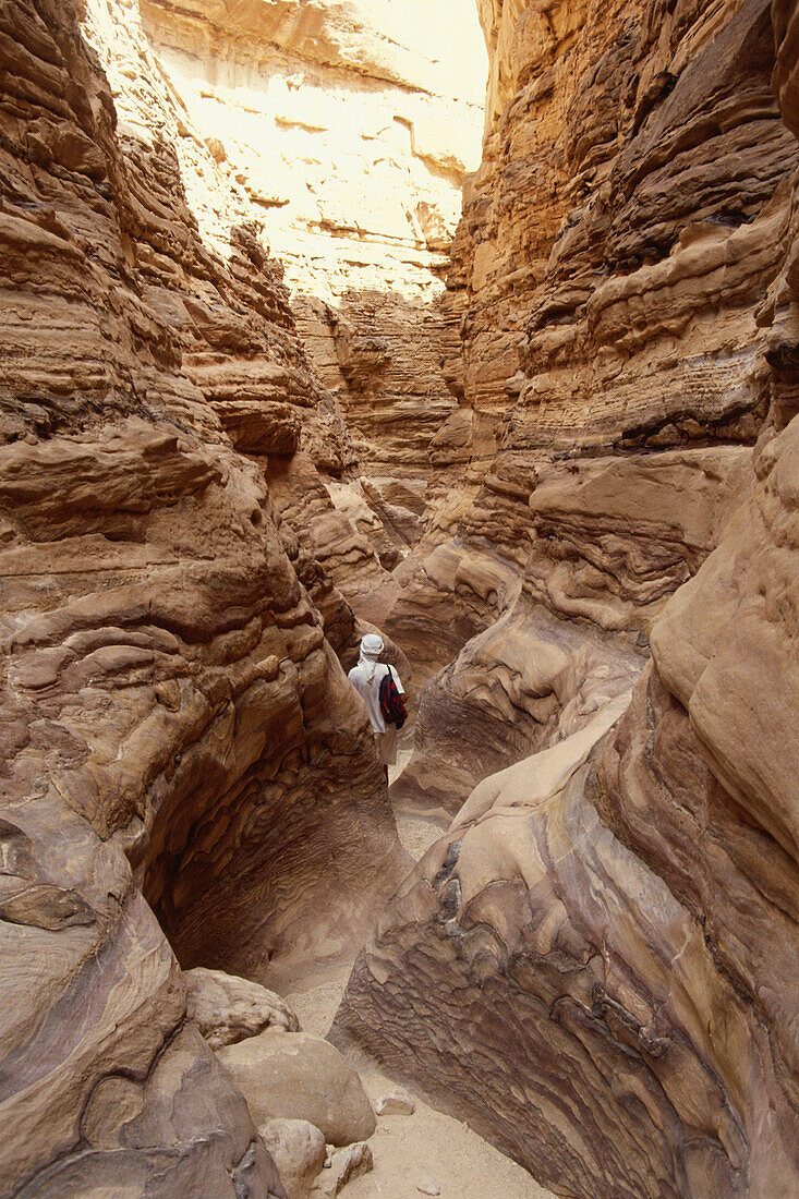 Man walking through the Coloured Canyon, Sinai, Egypt, Africa