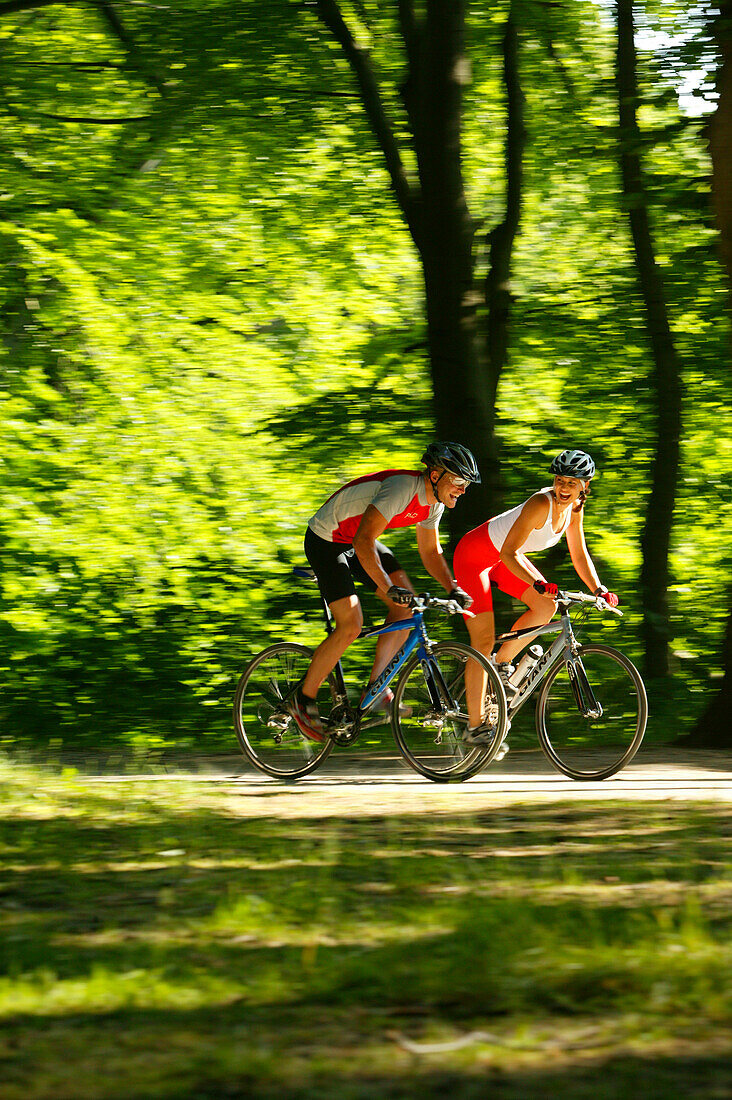 Young Couple cycling, fitness bikes, bavaria Germany