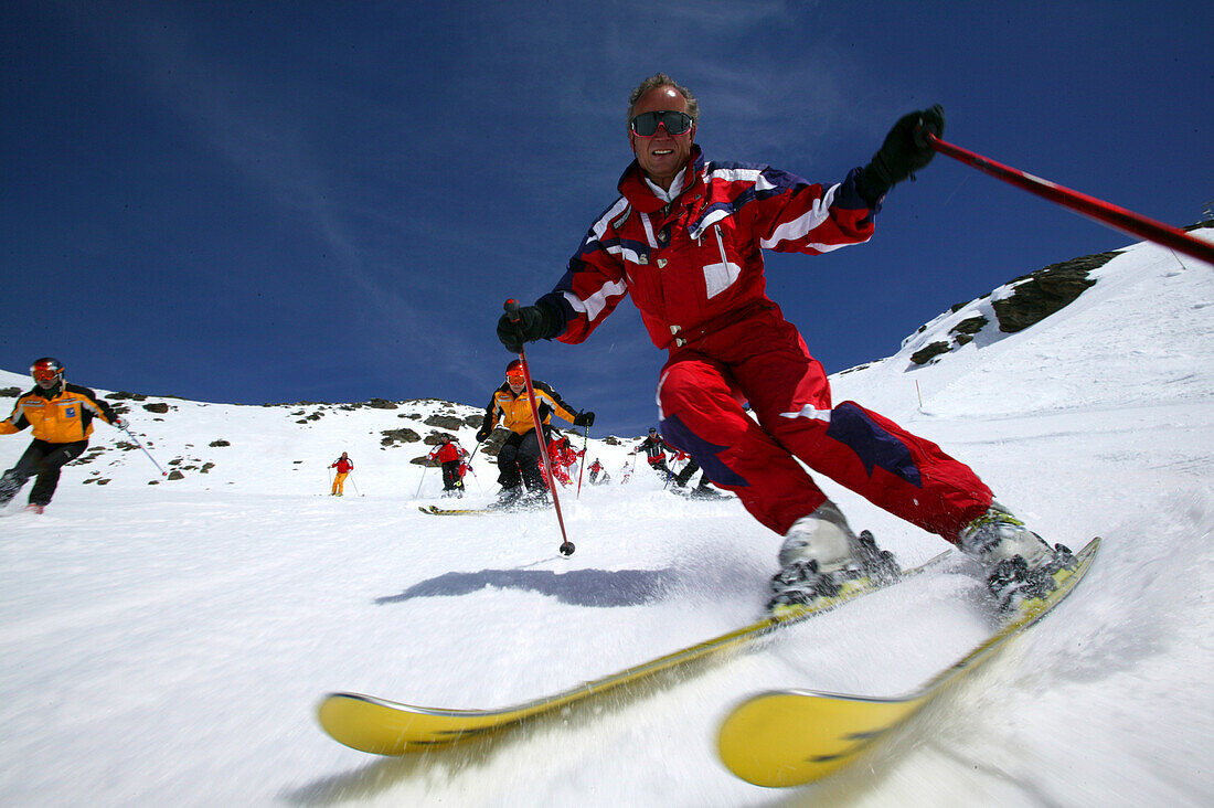 Group of skiers on the slope, Skiing downhill, Sulden, Italy