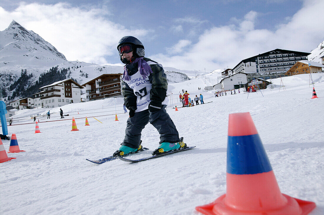Child in Ski Lesson, Wirl near Galtuer, Ballunspitze in Background, Tyrol, Austria