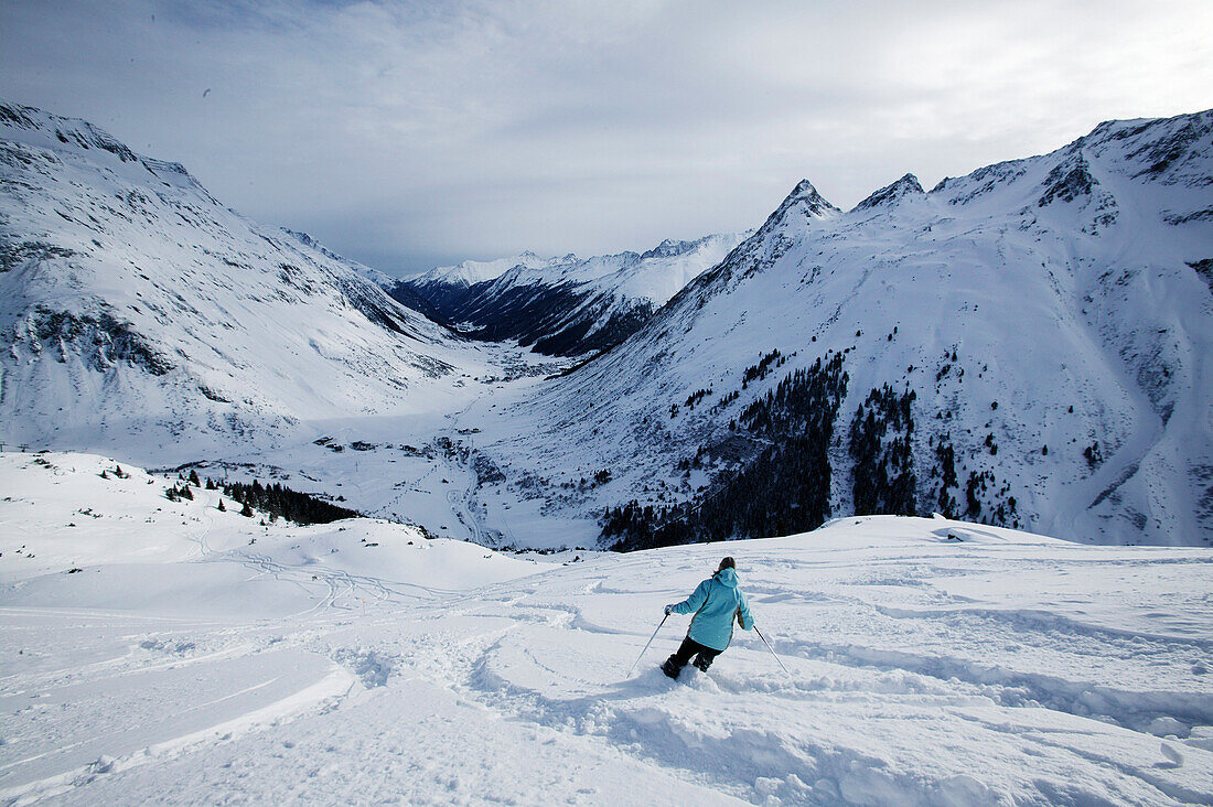 Person skiing in powder snow, Free Skiing, Ballunspitze, Wirl near Galtuer, Tyrol, Austria