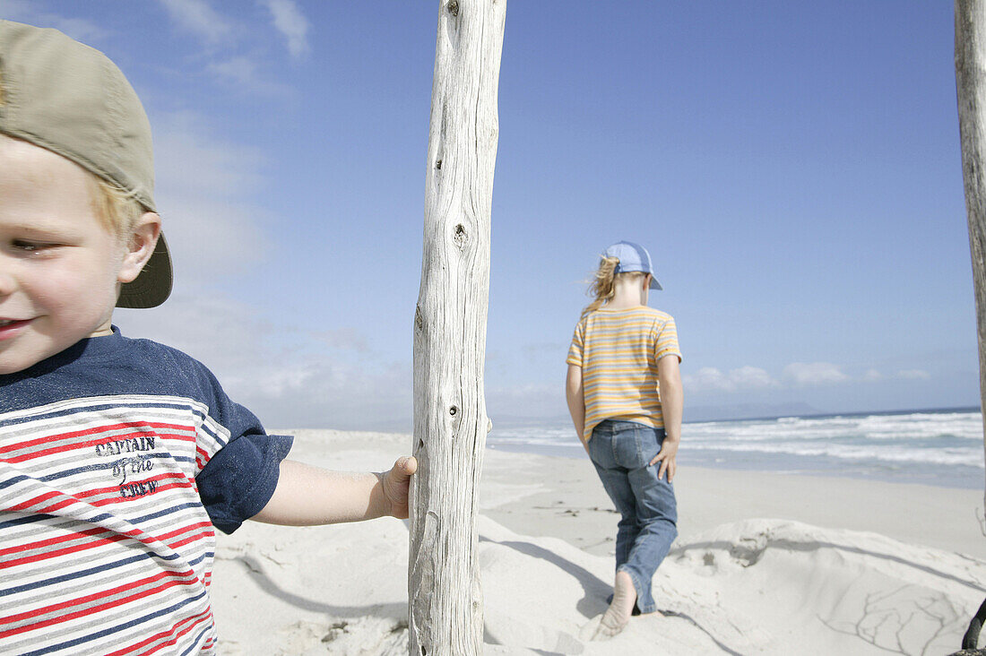 Children playing in the dunes on Grotto Beach, Hermanus, Western Cape, South Africa