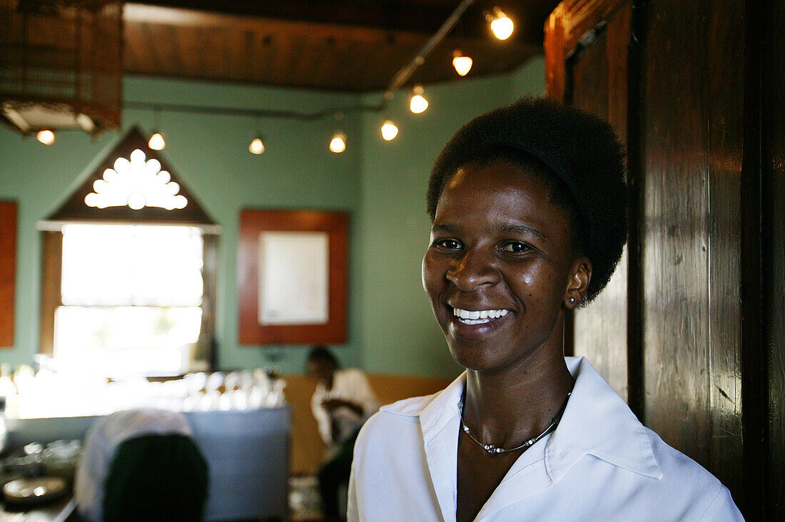 Waitress in a restaurant, Clock Tower, Victoria and Albert Waterfront, Cape Town, Western Cape, South Africa
