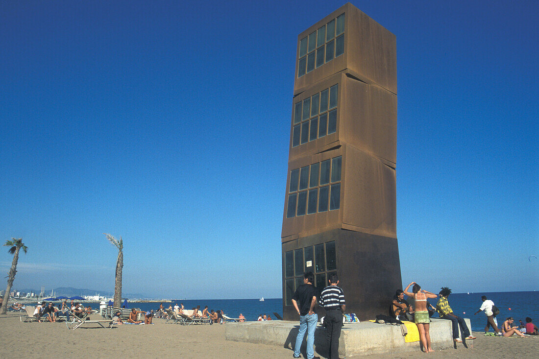People and sculpture on the beach, Playa Barceloneta, Barcelona, Spain, Europe
