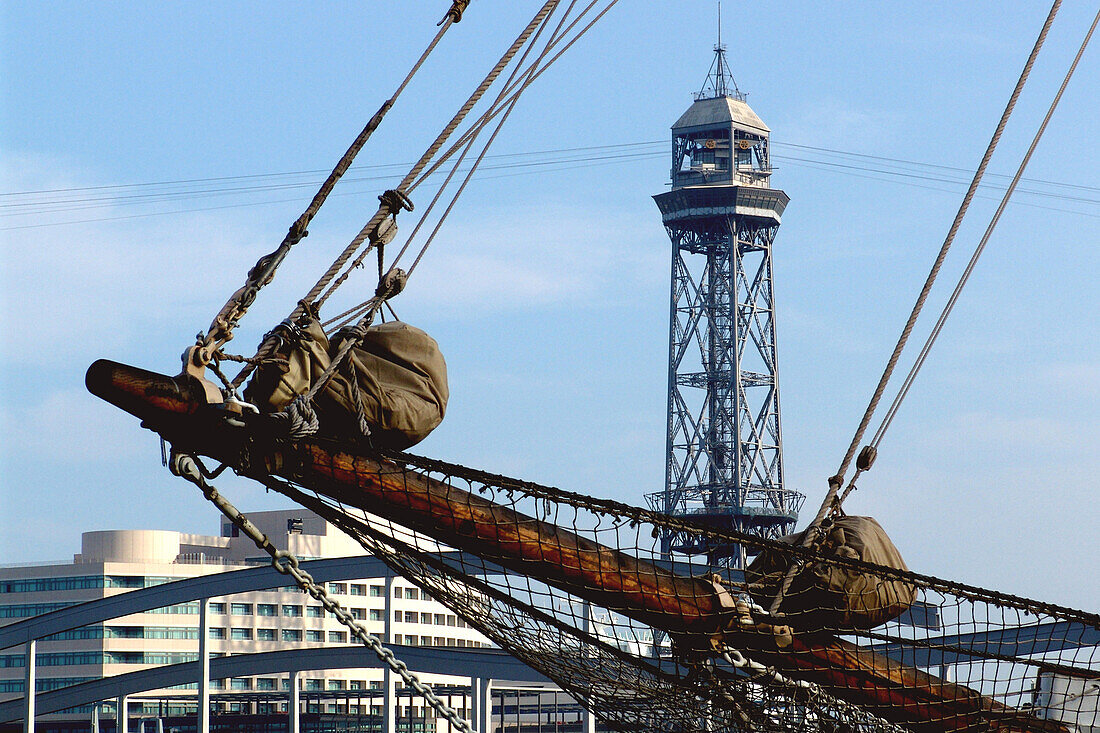 Bow of an old sailing ship and tower Torre Jaume at harbour, Port Vell, Barcelona, Spain, Europe