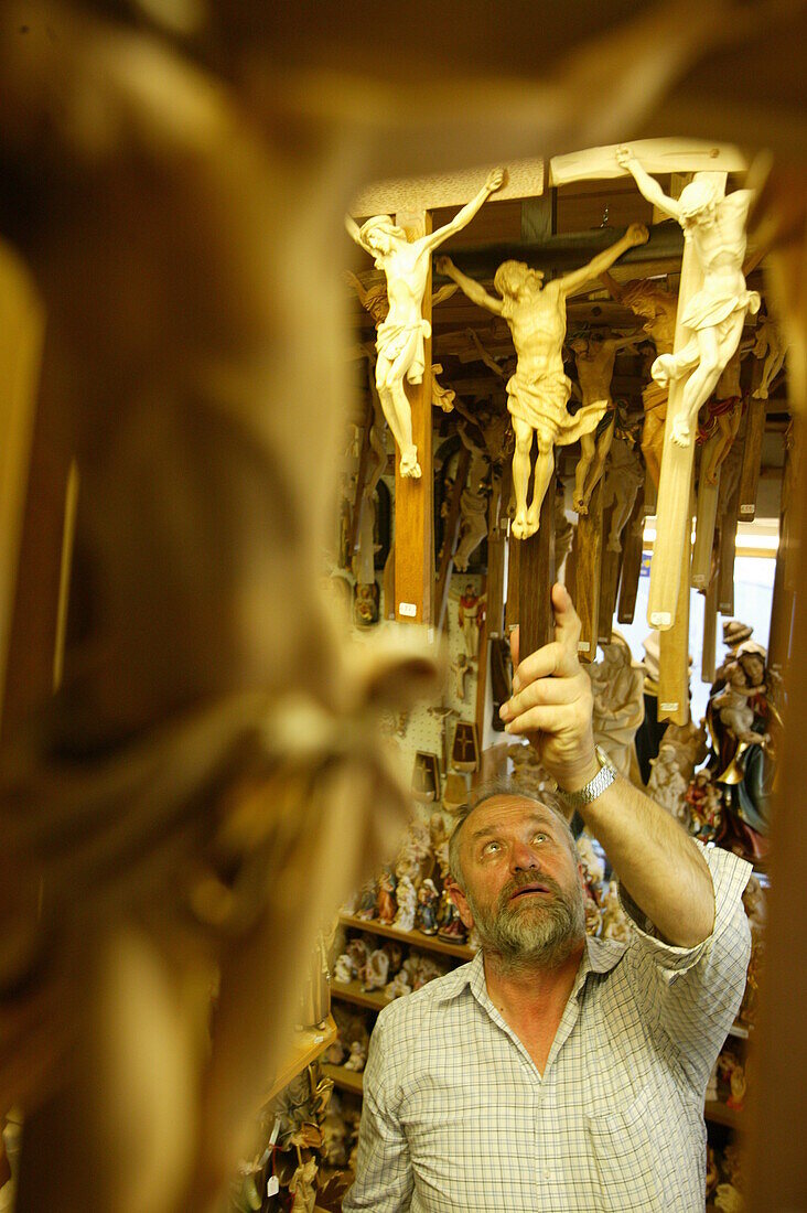 Man, wood carver selling carved wooden objects, Oberammergau, Bavaria, Germany