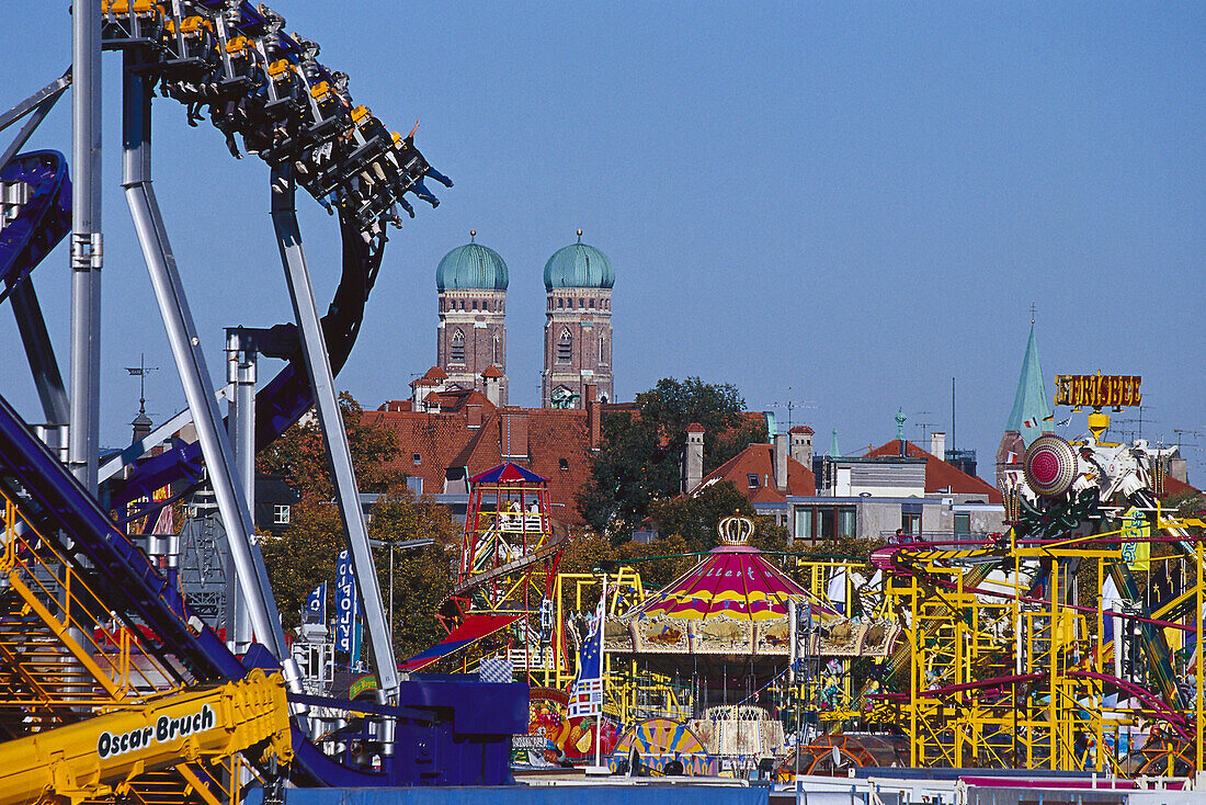 Fairground rides of the Oktoberfest in front of the Church of our Lady, Munich, Upper Bavaria, Bavaria, Germany, Europe