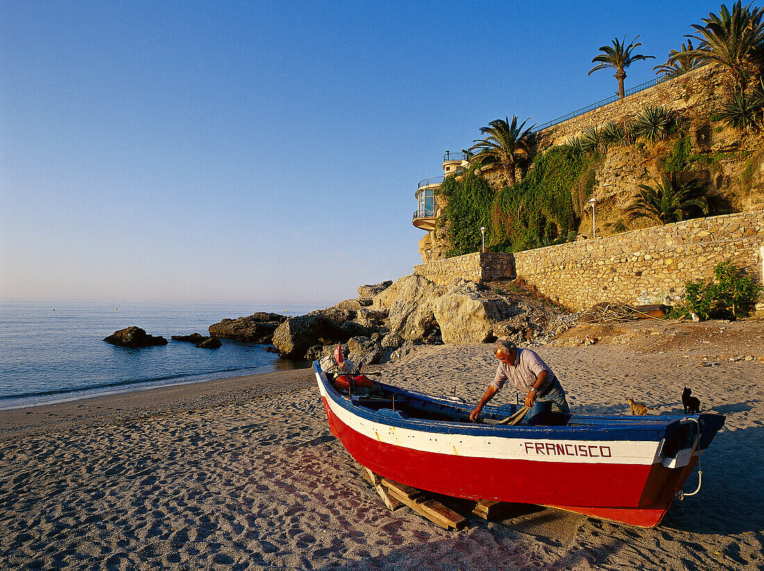 Fisherman at Playa de Calahonda beside Balcon de Europa, Nerja, Costa del Sol, Province of Mlaga, Andalusia, Spain
