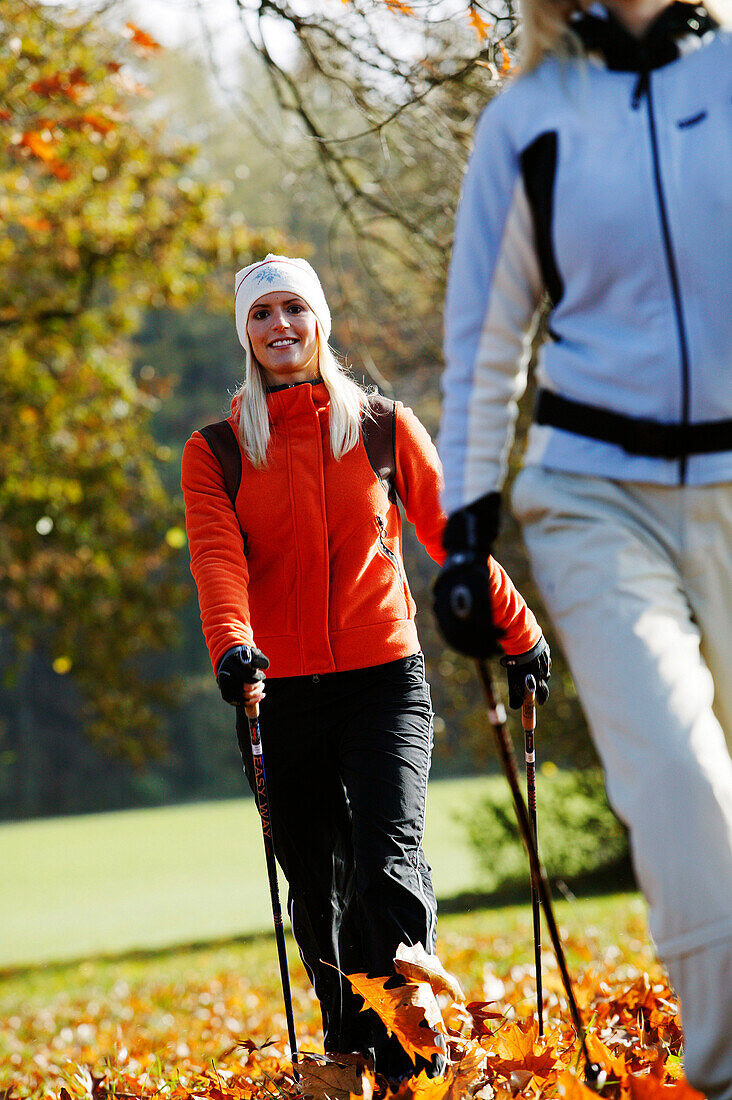 Young women Nordic Walking, Bavaria, Germany