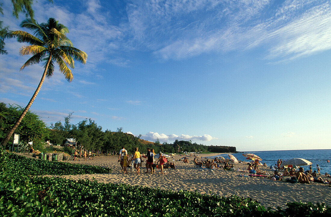 People sunbathing on Boucan Canot beach, La Réunion, Indian Ocean