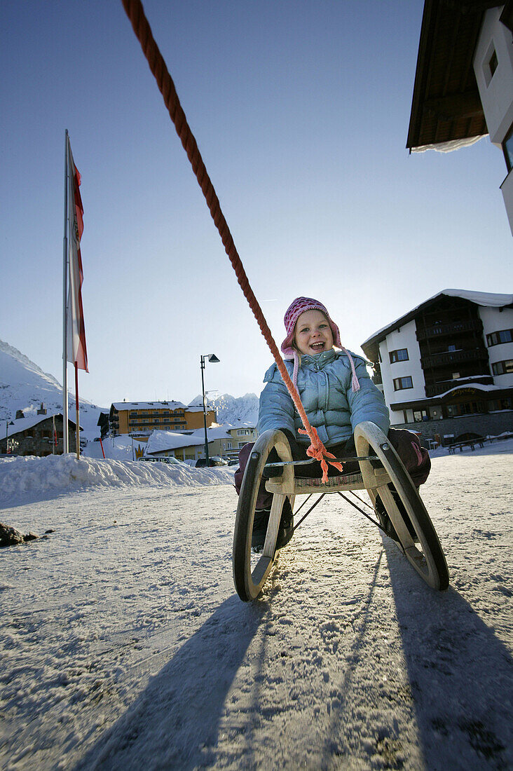 Little girl on sledge, Kuehtai, Tyrol, Austria
