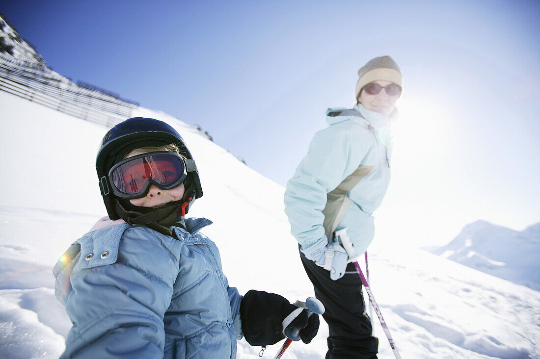 Mother and daughter skiing on slope, Kuhtai, Tyrol, Austria