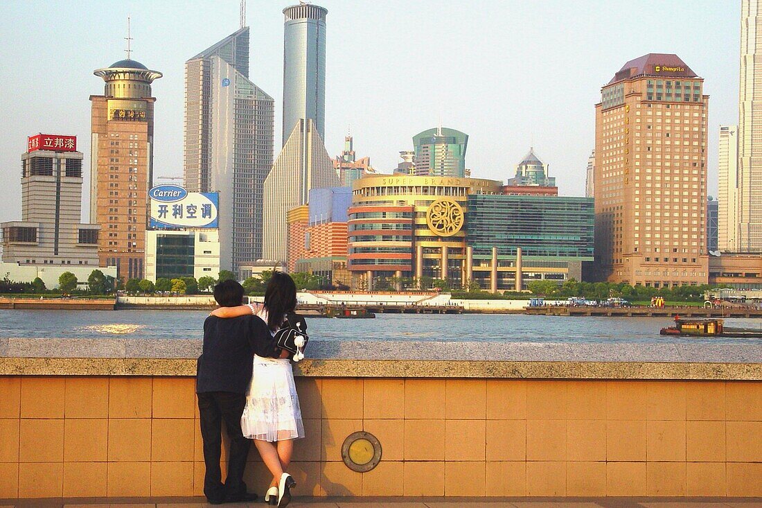 Pudong skyline and people at the river bank, Shanghai, China, Asia