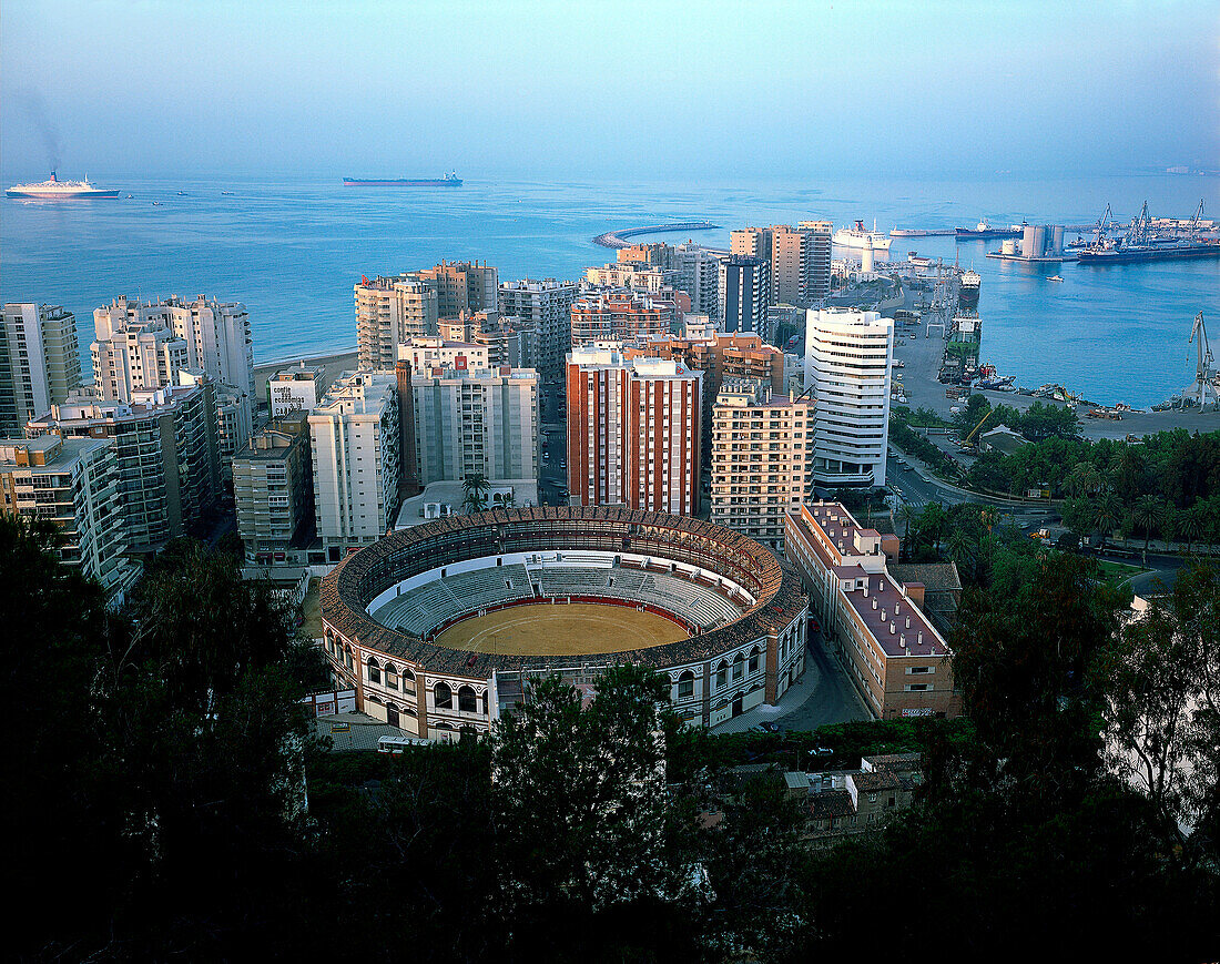 Cityscape with highrise buildings, Plaze de Toros and harbour, Mediterranean Sea, Málaga, Andalusia, Spain