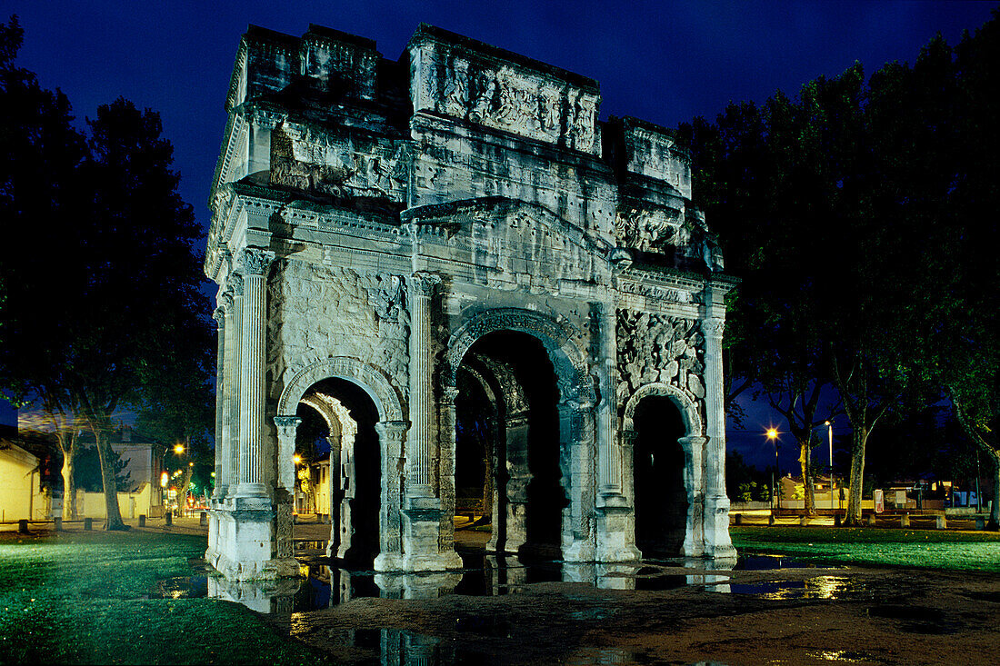 Illuminated triumphal arch at night, Orange, Provence, France, Europe