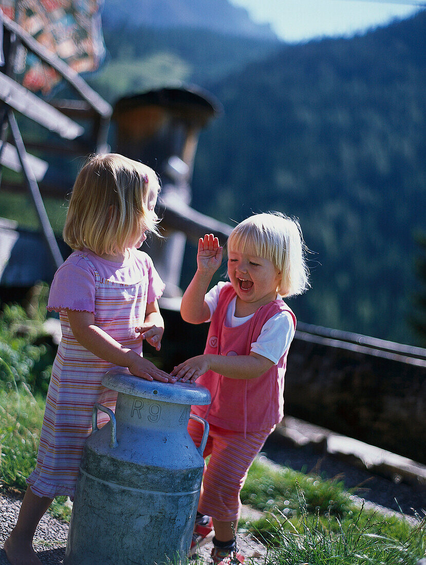 Two little girls, Two little girls playing and having fun, Ramsau am Bachstein, Styria, Austria