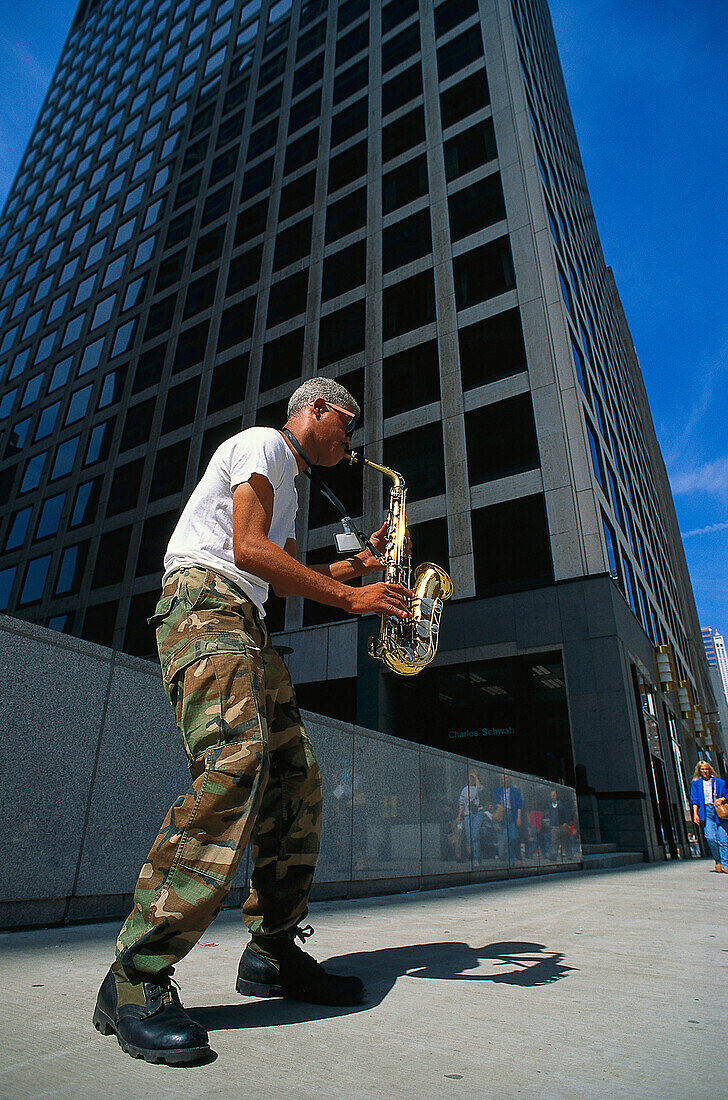 Street musician, man playing the saxophone, Chicago, Illinois, USA