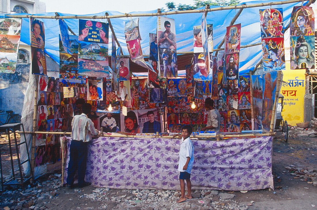 Poster, market stall, fair, Varanasi, Benares Uttar Pradesh, India