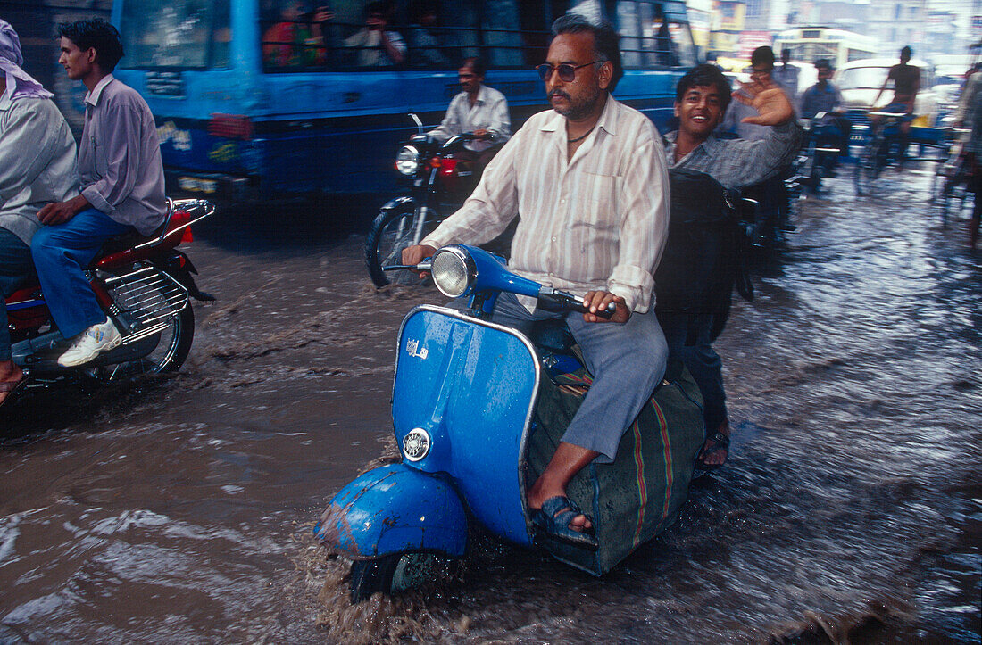 Motor scooter, monsoon, inundation, Varanasi, Benares, Uttar Pradesh, India