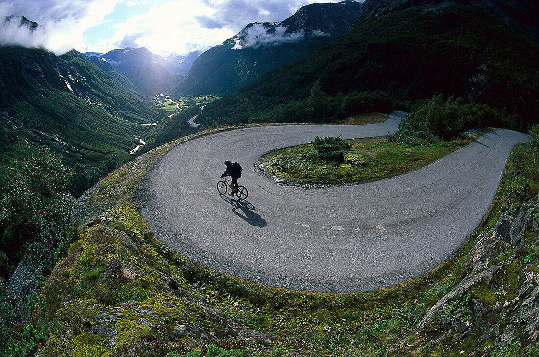 A person mountainbiking, Pass road, Strynefjellweg, Norway