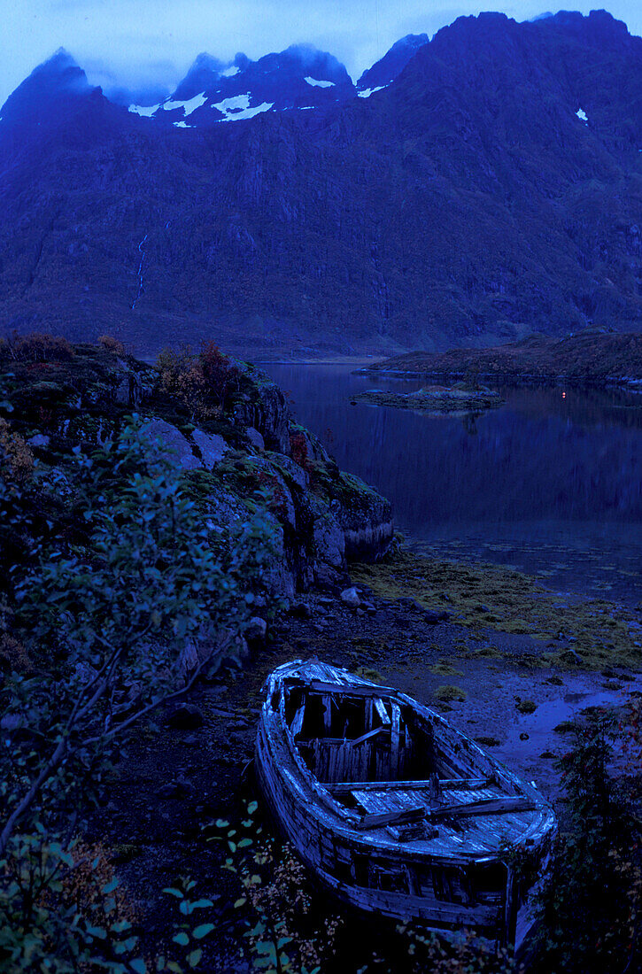 Shipwreck at Austnes Fjord in the evening, Lofoten, Norway, Europe