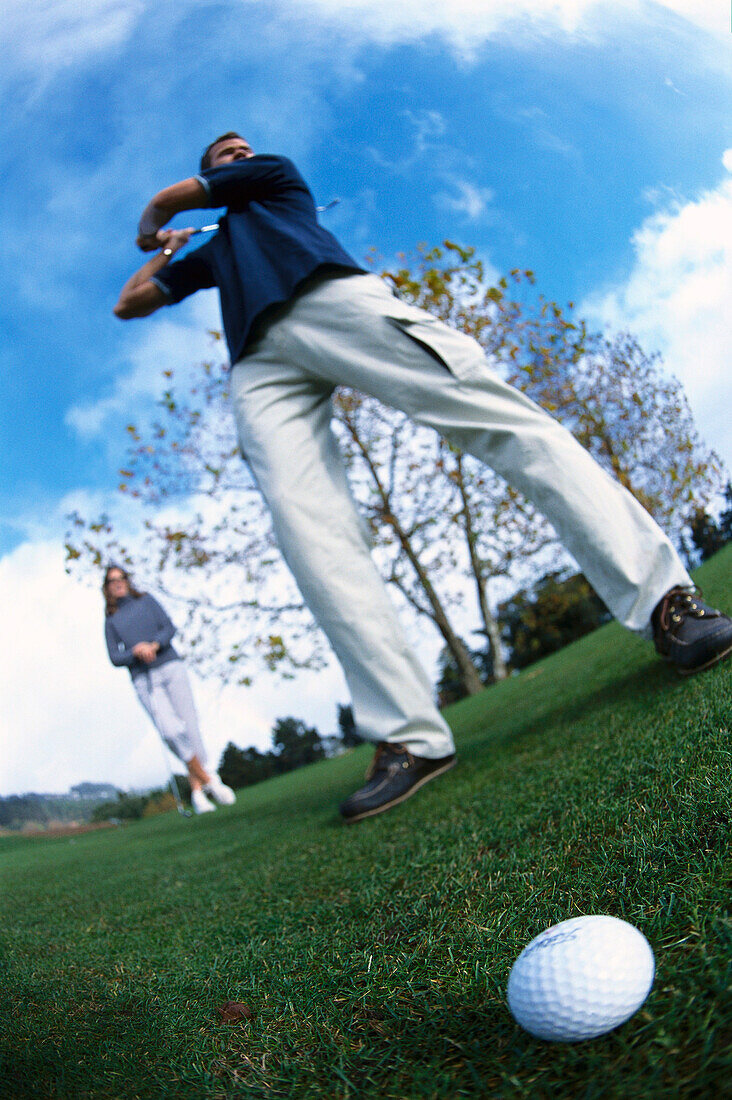A couple playing golf, Tee , Palheiro Golf Course, Sao Goncalo, Funchals, Madeira, Portugal