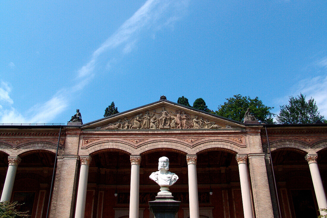 Bust at historical building, pump room in the park, Baden-Baden, Baden-Wuerttemberg, Germany, Europe