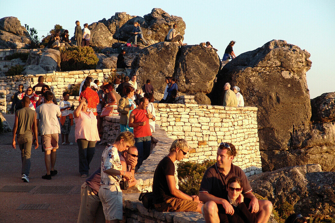 Tourists on table mountain in the evening light, Cape Town, South Africa, Africa