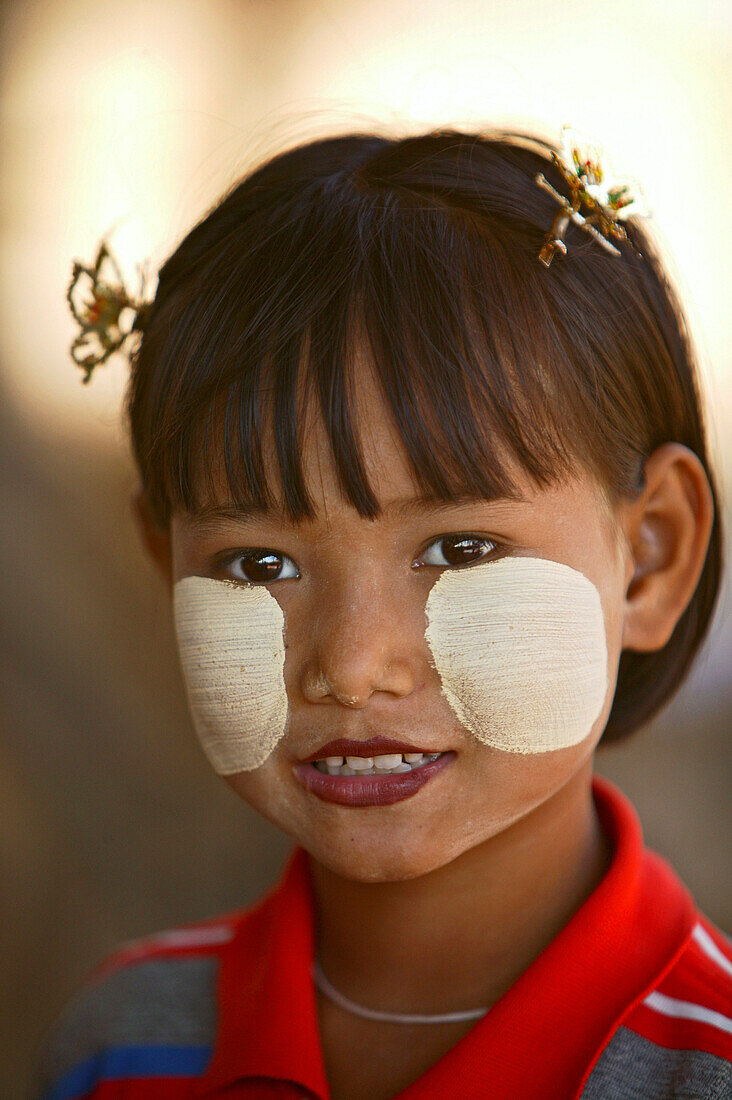 young girl with Tanaka powder as sunscreen, Myanmar