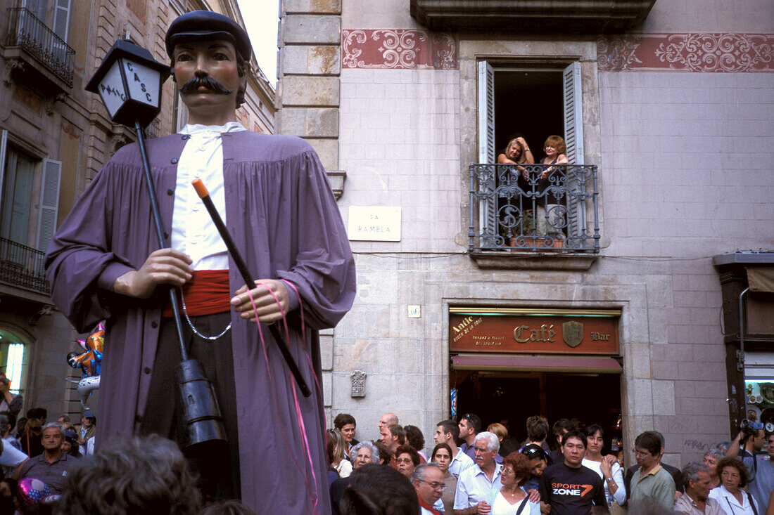 Figure of a saint and people on the street, Merce Celebration, Barcelona, Spain, Europe