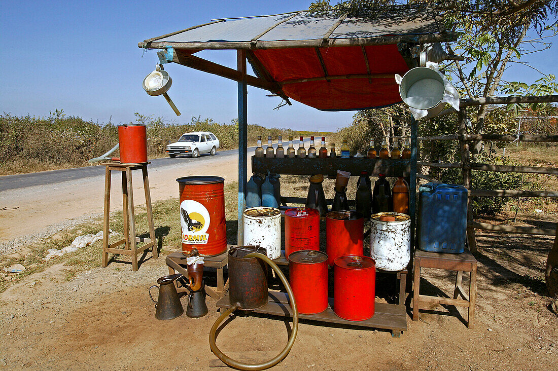 petrol pump, bottles, drums, country road, Burma, Myanmar