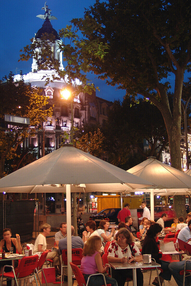 People at a street cafe in the evening, Passeig de Gracia, Barcelona, Spain, Europe