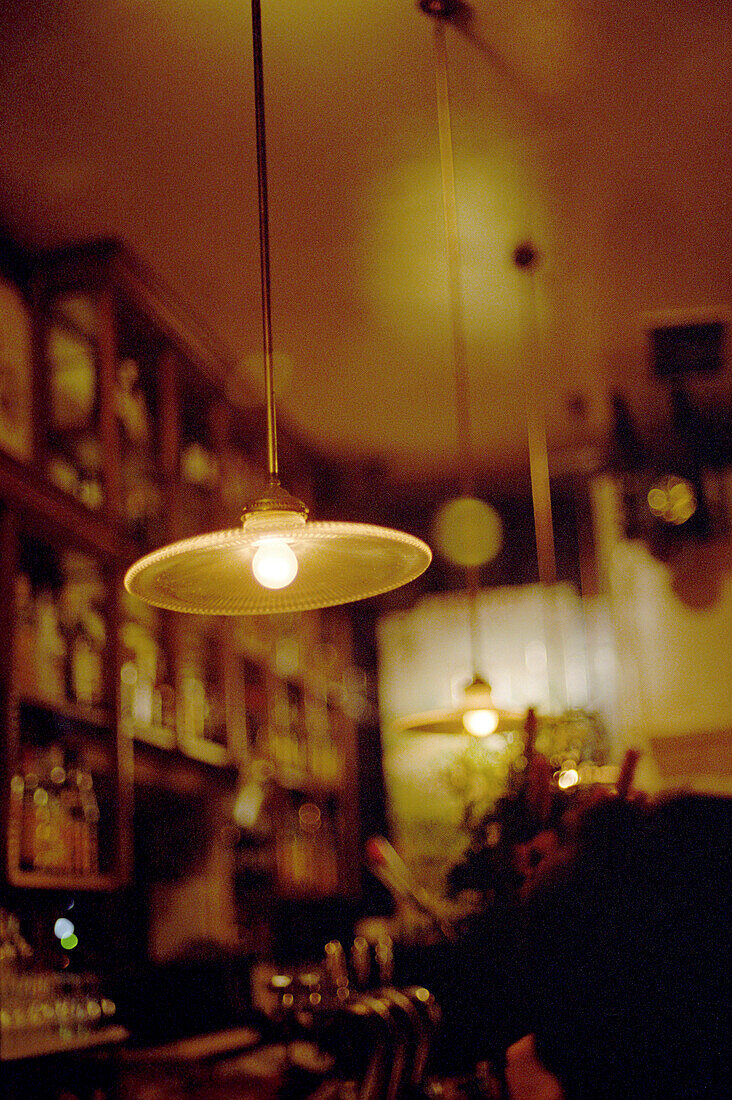 Lamps above the counter of a Tapas bar, Madrid, Spain, Europe