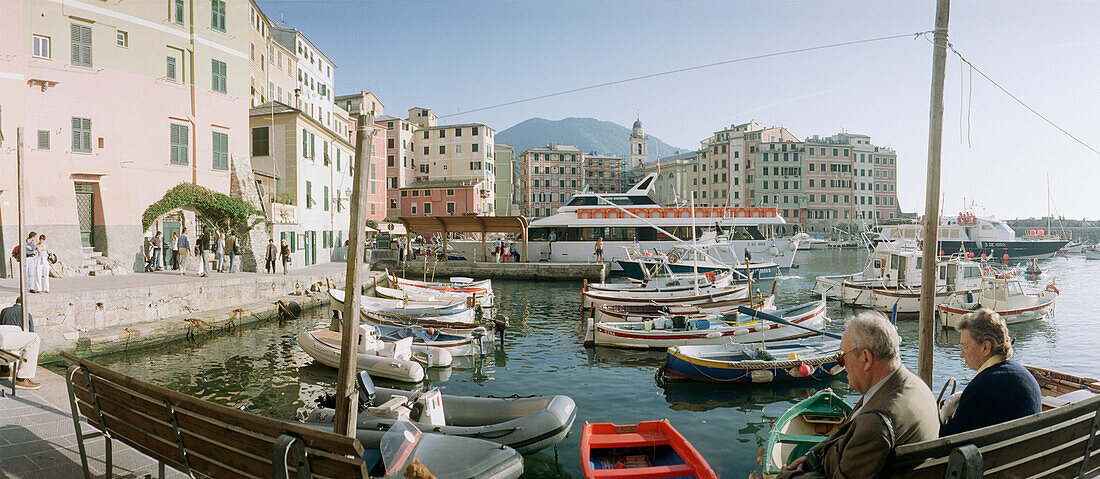 Seniors at the harbour, Camogli, Liguria, Italy