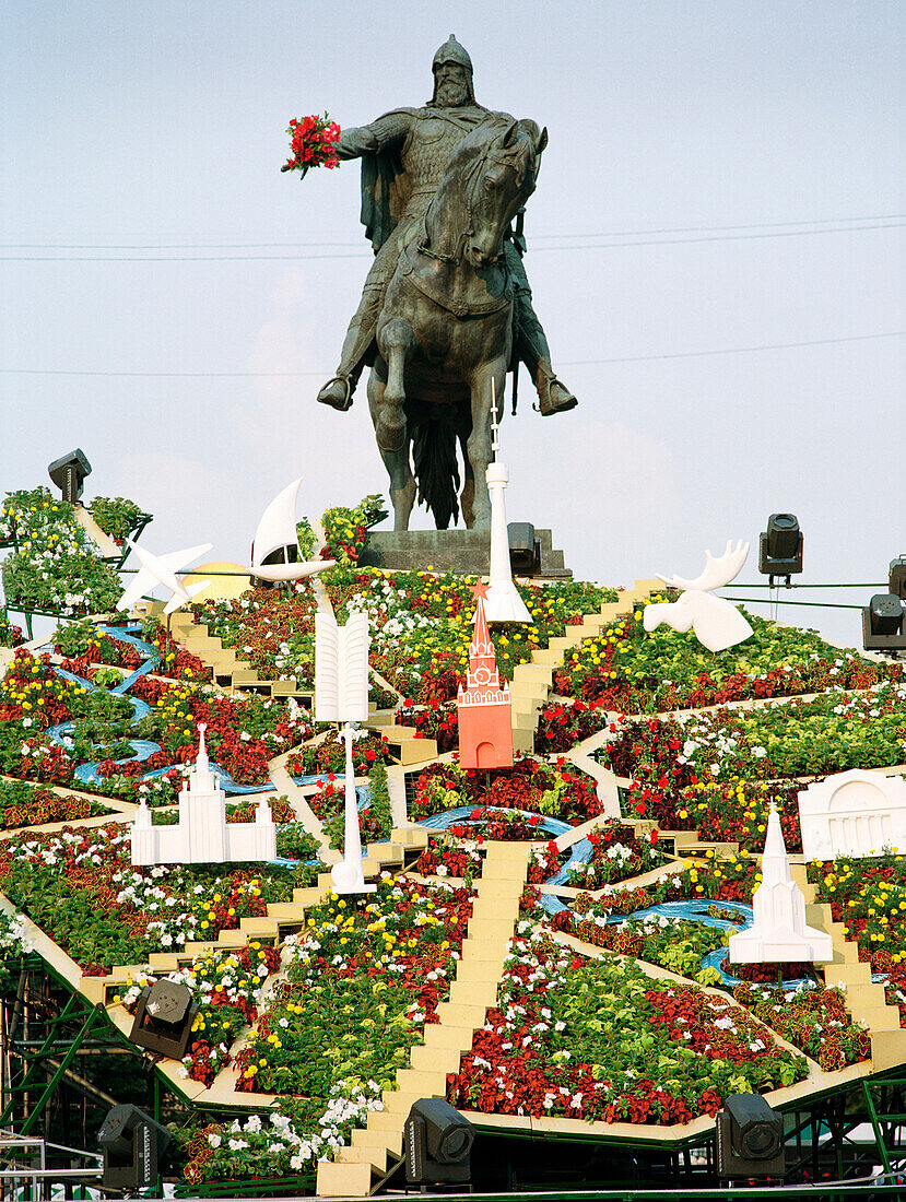 Flower bed in shape of a map in front of equestrian monument, Moscow, Russia
