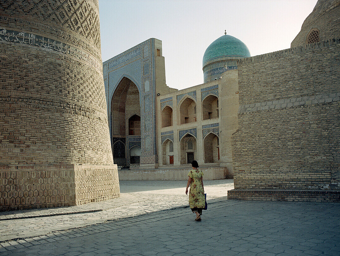 Woman on square, Mosque, Bukhara, Uzbekistan