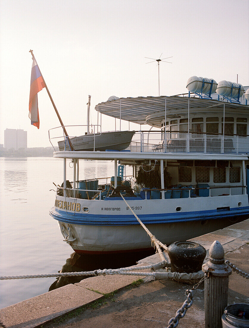 A deserted excursion boat is moored at the pier, Moscow Russia