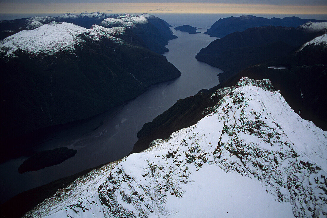 Aerial view of Doubtful Sound fiord in the snow, Fiordland National Park, West Coast, South Island, New Zealand, Oceania