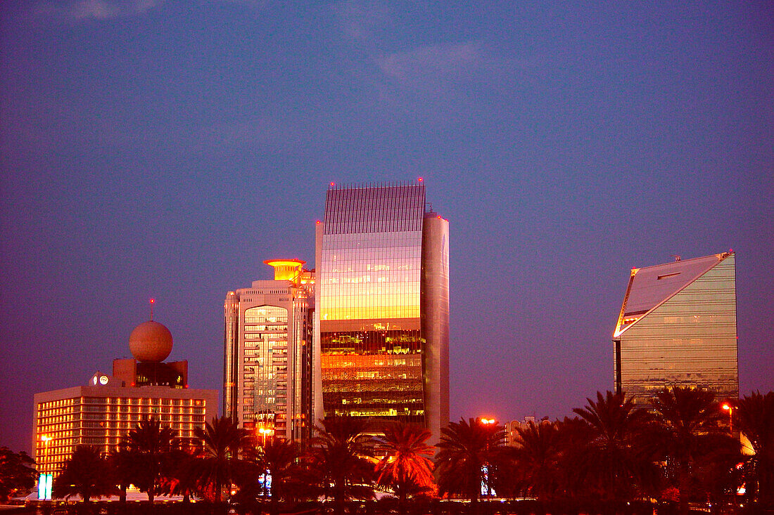 Illuminated high rise buildings in the evening, Deira, Dubai, UAE, United Arab Emirates, Middle East, Asia