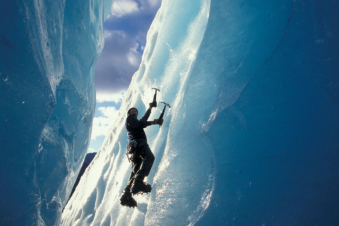Ice climber on steep climb, Briksdal Glacier, Norway