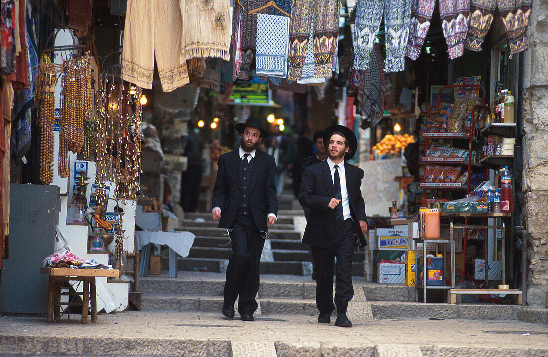 Two jews walking down an alley, arabic quarter, old town of Jerusalem, Israel