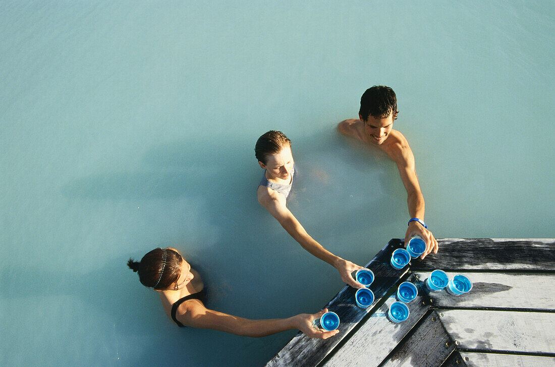 Visitors drinking cocktails in the Geothermal spa, Blue Lagoon at the geothermal power plant, Grindavik, Island